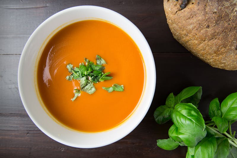 Creamy tomato basil soup with crusty bread at Chopt