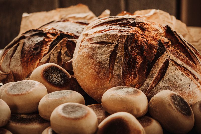 Warm sourdough bread roll served as a side