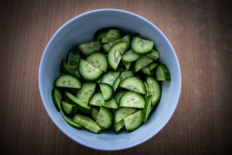 Fresh cold-pressed green juice with cucumber and apple